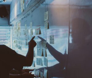 silhouetted figure in a working whiteboard session
