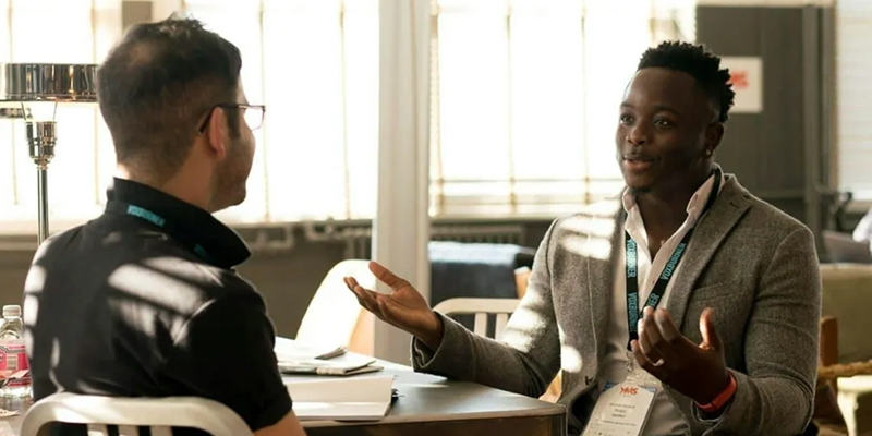 Two partners chatting at a table