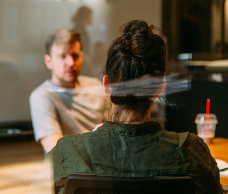 office-hours-intro two people in meeting room with a view through the glass